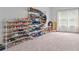A large walk-in closet features racks of shelving perfect for shoe storage at 312 Amble Side, Mcdonough, GA 30252