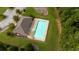 Overhead view of community pool with lounge area and green surroundings, offering a serene recreational space at 312 Amble Side, Mcdonough, GA 30252