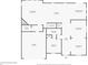 Detailed floor plan of the first floor, showcasing the layout of the kitchen, living areas, and garage at 312 Amble Side, Mcdonough, GA 30252