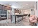 Bright, open kitchen featuring a large center island, modern appliances, and dark cabinets for great storage at 312 Amble Side, Mcdonough, GA 30252