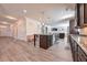 Spacious open-concept kitchen with modern appliances, granite countertops, and hardwood floors throughout at 312 Amble Side, Mcdonough, GA 30252