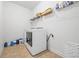 Practical laundry room with modern appliances, shelving, and ample space for sorting and folding laundry at 312 Amble Side, Mcdonough, GA 30252