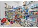 Walk-in pantry with metal shelving fully stocked with groceries and essentials, maximizing kitchen storage at 312 Amble Side, Mcdonough, GA 30252