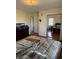 Bedroom featuring a bed, closet, and wood floors at 3674 Canton Rd, Marietta, GA 30066
