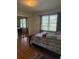 Relaxing bedroom with a comfortable bed, mirrored closet doors, and natural light from the window at 3674 Canton Rd, Marietta, GA 30066
