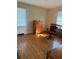 This bedroom features a bright window, hardwood floors, and a classic wooden dresser at 3674 Canton Rd, Marietta, GA 30066