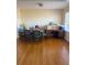 A dining area with hardwood floors, table and chairs plus natural light from a window at 3674 Canton Rd, Marietta, GA 30066
