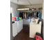 Laundry room area with a washer, dryer, and a hanging rack for clothes at 3674 Canton Rd, Marietta, GA 30066