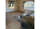 Living room featuring carpet, a large window, and a glass coffee table at 3674 Canton Rd, Marietta, GA 30066