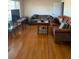 Cozy living room featuring hardwood floors and comfortable seating arrangements at 3674 Canton Rd, Marietta, GA 30066