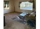 The living room features neutral carpet, large bright windows, and modern touches at 3674 Canton Rd, Marietta, GA 30066