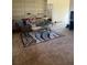 Living room showcasing built-in shelves, carpet, and a rug with a patterned design at 3674 Canton Rd, Marietta, GA 30066