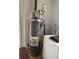 This utility room features a newer model water heater, and a washing machine at 3674 Canton Rd, Marietta, GA 30066