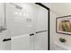 Modern bathroom featuring a glass shower with a rainfall shower head and matte black hardware at 1990 Venetian Sw Dr, Atlanta, GA 30311