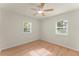 Sunny bedroom with natural light from two windows and wood flooring at 1990 Venetian Sw Dr, Atlanta, GA 30311