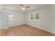 Inviting bedroom with light wood flooring and natural light from two large windows at 1990 Venetian Sw Dr, Atlanta, GA 30311