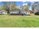 Charming one-story home with manicured front yard, walkway, brick chimney, and lovely front yard at 1990 Venetian Sw Dr, Atlanta, GA 30311