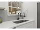 Close up of the stylish kitchen sink featuring sleek fixtures and bright natural light at 1990 Venetian Sw Dr, Atlanta, GA 30311