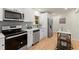 Well-lit kitchen with stainless steel appliances, white cabinets, and modern finishes at 1990 Venetian Sw Dr, Atlanta, GA 30311