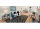Open concept living and dining rooms provide ample seating, natural light, and stylish decor at 1990 Venetian Sw Dr, Atlanta, GA 30311