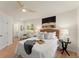 Serene main bedroom featuring neutral decor, modern ceiling fan, and an ensuite bathroom at 1990 Venetian Sw Dr, Atlanta, GA 30311