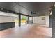 Large covered patio with stylish ceiling fans, mosaic flooring, and decorative brick pillars at 1990 Venetian Sw Dr, Atlanta, GA 30311