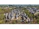An aerial view showcases a vibrant community nestled among lush greenery with the city skyline in the distance at 6812 Cadence Blvd, Atlanta, GA 30328