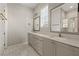 Bathroom with double sink vanity, modern mirrors, and marble tile floors at 6812 Cadence Blvd, Atlanta, GA 30328