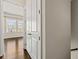 Bedroom featuring hardwood floors and natural light from windows overlooking the neighborhood at 6812 Cadence Blvd, Atlanta, GA 30328