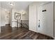 Apartment hallway with unit number, dark wood floors, and stairway at 6812 Cadence Blvd, Atlanta, GA 30328