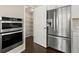 Modern kitchen with stainless steel appliances and a walk-in pantry at 6812 Cadence Blvd, Atlanta, GA 30328