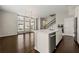 Open concept living and kitchen area with hardwood floors and stainless steel appliances at 6812 Cadence Blvd, Atlanta, GA 30328