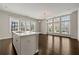 Open concept living and kitchen area with hardwood floors and stainless steel appliances at 6812 Cadence Blvd, Atlanta, GA 30328