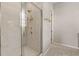 Elegant bathroom shower with frameless glass door and tiled walls at 6812 Cadence Blvd, Atlanta, GA 30328