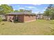 Spacious backyard featuring a brick home, with a large grassy area at 131 Brownlee Rd, Atlanta, GA 30331
