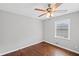 Bedroom with hardwood floors, gray walls, a ceiling fan, and a window view to the outside at 131 Brownlee Rd, Atlanta, GA 30331