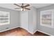 Bright bedroom featuring hardwood floors, a ceiling fan, and double door closet at 131 Brownlee Rd, Atlanta, GA 30331