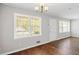 Spacious room with hardwood floors, large windows, and modern lighting, perfect for relaxation and entertaining guests at 131 Brownlee Rd, Atlanta, GA 30331