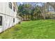 Expansive backyard featuring lush green grass, mature trees, and plenty of space for outdoor activities at 2491 Falcon Ridge Dr, Grayson, GA 30017