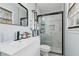 Beautiful bathroom with walk in shower, white cabinets and black hardware at 2491 Falcon Ridge Dr, Grayson, GA 30017