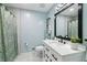 Stylish bathroom boasts a modern vanity, sleek fixtures, elegant shower curtain, and a calming color scheme at 2491 Falcon Ridge Dr, Grayson, GA 30017