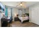 Inviting bedroom boasts a desk, television, neutral color palette, and a well-lit workspace at 2491 Falcon Ridge Dr, Grayson, GA 30017