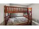 Cozy bedroom with a wooden bunk bed and soft gray bedding providing a comfortable and functional space at 2491 Falcon Ridge Dr, Grayson, GA 30017