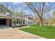 Charming two-story home with a well-maintained lawn, black shutters and mature trees at 2491 Falcon Ridge Dr, Grayson, GA 30017