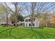 Charming two-story home with a well-maintained lawn, black shutters and mature trees at 2491 Falcon Ridge Dr, Grayson, GA 30017