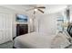 Spacious main bedroom with ceiling fan, mounted tv, plenty of closet space and attached bath at 2491 Falcon Ridge Dr, Grayson, GA 30017