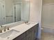 This is a bathroom with double sinks, granite countertops, tile floors and shower/tub at 407 Johnson Ct, Alpharetta, GA 30009