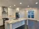 Bright kitchen features an island with marble countertop and stainless steel appliances at 407 Johnson Ct, Alpharetta, GA 30009