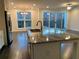 Bright kitchen with granite countertops, stainless steel appliances, and hardwood floors at 407 Johnson Ct, Alpharetta, GA 30009