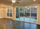 Sun-filled living room with access to the backyard through sliding glass doors at 407 Johnson Ct, Alpharetta, GA 30009